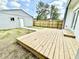 A wooden deck and green yard offer a perfect outdoor living space at 1721 Thaddeus St, Indianapolis, IN 46203