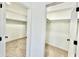 Pair of walk-in closets with carpet, shelving, and ample storage space at 1721 Thaddeus St, Indianapolis, IN 46203