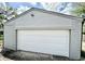 A well-maintained two car garage painted in neutral colors at 1721 Thaddeus St, Indianapolis, IN 46203