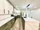 Well-lit kitchen with modern cabinets, stainless steel appliances, and a stylish center island at 1721 Thaddeus St, Indianapolis, IN 46203