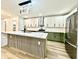 Bright kitchen with a large center island, stainless steel appliances, and stylish lighting at 1721 Thaddeus St, Indianapolis, IN 46203