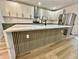 Stylish kitchen featuring a large island with wooden accents and stainless steel appliances at 1721 Thaddeus St, Indianapolis, IN 46203