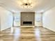 Spacious living room with a modern fireplace and ample natural light at 1721 Thaddeus St, Indianapolis, IN 46203