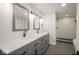 Bathroom with double sinks, white countertops, modern fixtures, and stylish tile shower at 1737 W 1000 N, Alexandria, IN 46001