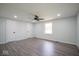 Spacious bedroom featuring a ceiling fan, natural light from the window, and ample closet space at 1737 W 1000 N, Alexandria, IN 46001