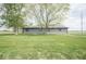 Rear view of a well maintained exterior home with manicured green grass at 1737 W 1000 N, Alexandria, IN 46001