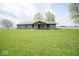 Well-maintained single-story home with inviting covered porch and expansive front yard at 1737 W 1000 N, Alexandria, IN 46001