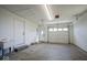 Spacious garage featuring multiple doors and concrete floor at 1737 W 1000 N, Alexandria, IN 46001