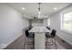 Bright eat-in kitchen with granite countertop, lighting fixture and black chairs at 1737 W 1000 N, Alexandria, IN 46001