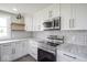 Well-appointed kitchen with stainless steel oven, white cabinets, and granite countertops at 1737 W 1000 N, Alexandria, IN 46001