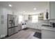Spacious kitchen featuring stainless steel appliances, granite counters and a farmhouse sink at 1737 W 1000 N, Alexandria, IN 46001