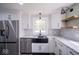 Modern kitchen features stainless steel appliances, a black farmhouse sink, and granite countertops at 1737 W 1000 N, Alexandria, IN 46001