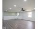 Spacious living room with grey walls, hardwood floors, and a ceiling fan at 1737 W 1000 N, Alexandria, IN 46001