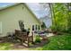 Outdoor deck with a grill and dining set, perfect for entertaining and relaxing in the backyard oasis at 19519 Creekview Dr, Noblesville, IN 46062