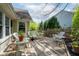 Charming rear deck with wicker furniture, creating a cozy outdoor living space for relaxation and entertaining friends at 19519 Creekview Dr, Noblesville, IN 46062