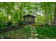 A charming gazebo surrounded by lush landscaping provides a peaceful retreat in this home's beautiful backyard at 19519 Creekview Dr, Noblesville, IN 46062