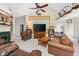 Spacious living area with a ceiling fan, TV, comfortable seating, and a glimpse into the bedroom at 19519 Creekview Dr, Noblesville, IN 46062