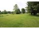 Sprawling, green backyard perfect for outdoor activities and relaxation at 2237 W 100 N, Greenfield, IN 46140
