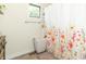 Bright bathroom featuring a floral shower curtain and a practical laundry basket at 2237 W 100 N, Greenfield, IN 46140