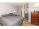 Comfortable bedroom featuring wood-look floors, a neutral paint, and bathroom access, creating a relaxing atmosphere at 2237 W 100 N, Greenfield, IN 46140