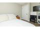 Serene bedroom featuring a flat-screen TV, wood-look floors, and a neutral color scheme perfect for rest and relaxation at 2237 W 100 N, Greenfield, IN 46140