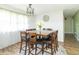 Elegant dining room featuring a square table, stylish decor, and hardwood flooring at 2237 W 100 N, Greenfield, IN 46140