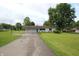 Charming ranch home with attached two-car garage, long driveway, and well-maintained yard at 2237 W 100 N, Greenfield, IN 46140