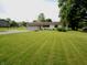 Charming ranch home with attached two-car garage and a spacious front yard at 2237 W 100 N, Greenfield, IN 46140