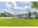 Charming single-story home featuring a two car garage, a well manicured lawn and basketball court at 2237 W 100 N, Greenfield, IN 46140