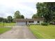 Charming ranch home with attached two-car garage and well-manicured lawn at 2237 W 100 N, Greenfield, IN 46140