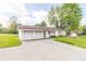 Charming single-story home featuring a two car garage and a well manicured lawn at 2237 W 100 N, Greenfield, IN 46140