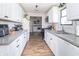 Modern kitchen featuring white cabinets, granite countertops, and stainless steel appliances at 2237 W 100 N, Greenfield, IN 46140