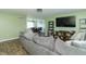 Spacious living room open to dining area, featuring hardwood flooring and comfortable seating at 2237 W 100 N, Greenfield, IN 46140