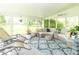 Sunroom with comfortable seating, natural light, and a view of the backyard at 2237 W 100 N, Greenfield, IN 46140