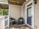 Comfortable back porch with seating provides a relaxing view of the backyard at 2403 N Delaware St, Indianapolis, IN 46205