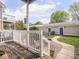 Inviting back porch features wood flooring and white railing overlooking a walkway at 2403 N Delaware St, Indianapolis, IN 46205