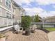 Well maintained backyard brick patio with fire pit and chairs, perfect for outdoor gatherings at 2403 N Delaware St, Indianapolis, IN 46205