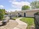 Beautiful backyard with a paved patio and walkway leading to a multi-car garage at 2403 N Delaware St, Indianapolis, IN 46205
