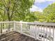 Balcony with trees in the background and a white car visible at 2403 N Delaware St, Indianapolis, IN 46205