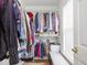 Walk-in closet featuring ample hanging storage and a window seat at 2403 N Delaware St, Indianapolis, IN 46205