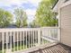 A wood deck featuring white wood railings, overlooking the property at 2403 N Delaware St, Indianapolis, IN 46205