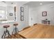 A naturally lit dining area features a wood table and seating adjacent to the kitchen area at 2403 N Delaware St, Indianapolis, IN 46205