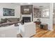 Cozy living room featuring a fireplace, built-in bookshelves, and hardwood floors at 2403 N Delaware St, Indianapolis, IN 46205