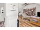 Bright living room with a bookshelf and hardwood floors at 2403 N Delaware St, Indianapolis, IN 46205