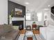 Living room featuring a modern fireplace, neutral walls, and an open layout at 2403 N Delaware St, Indianapolis, IN 46205