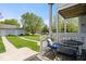 Back porch area with chairs and table overlooking backyard at 2405 N Park Ave, Indianapolis, IN 46205
