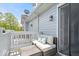 Cozy balcony with comfortable seating and light blue siding, perfect for relaxing outdoors at 2405 N Park Ave, Indianapolis, IN 46205
