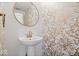 Stylish powder room featuring a round mirror and elegant wallpaper at 2405 N Park Ave, Indianapolis, IN 46205