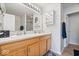Bathroom featuring double sinks, a large mirror, and stylish cabinets at 2405 N Park Ave, Indianapolis, IN 46205