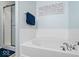 Relaxing bathroom with a soaking tub and a separate shower with a glass door at 2405 N Park Ave, Indianapolis, IN 46205
